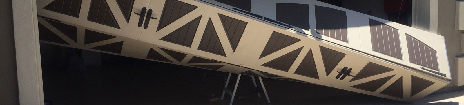Old garage door misaligned before new sectional installation in Colleyville home